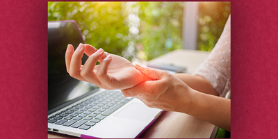 Image of hand pain while at laptop