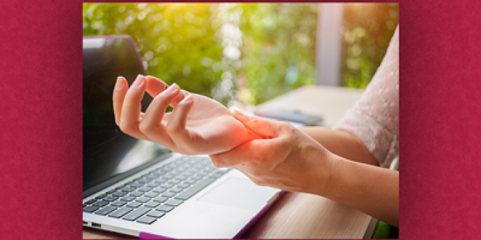 Image of hand pain while at laptop